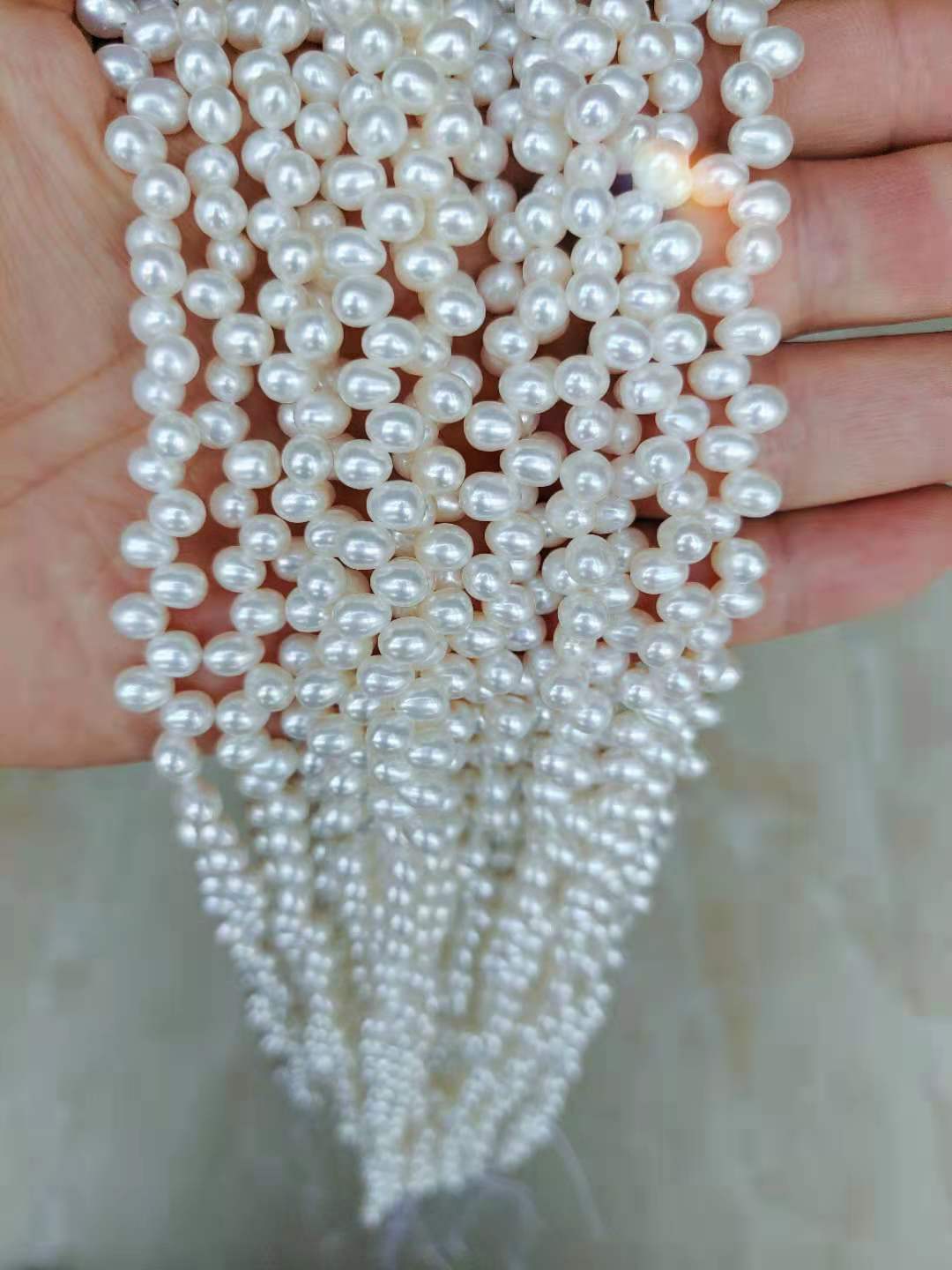 5-6 mm AAA rice pearl side hole Raw Pearls nature pearl loose Pearl suppliers and wholesale freshwater pearl with farm direct prices